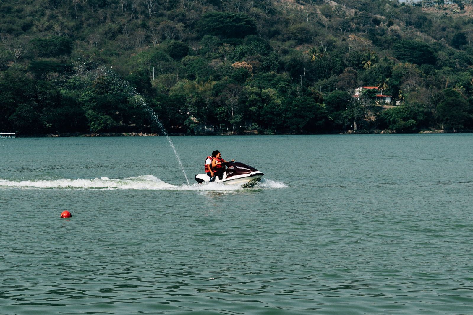 A jet ski crossing a lake