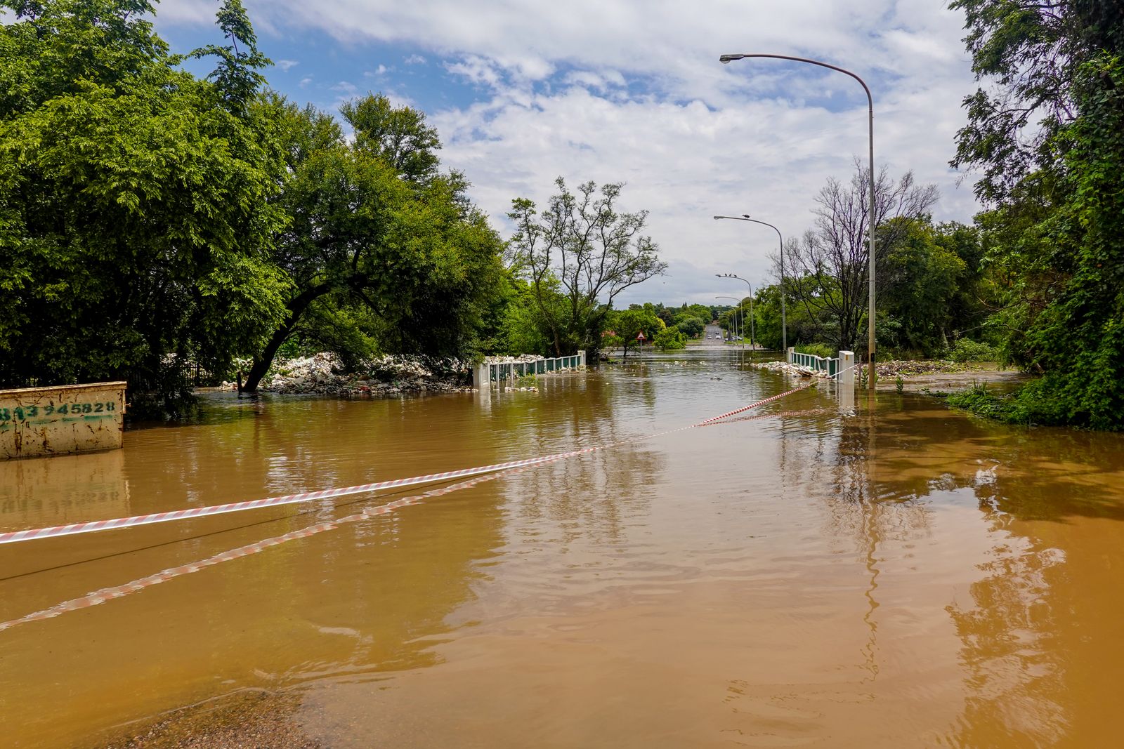 A road under floodwater after heavy rain