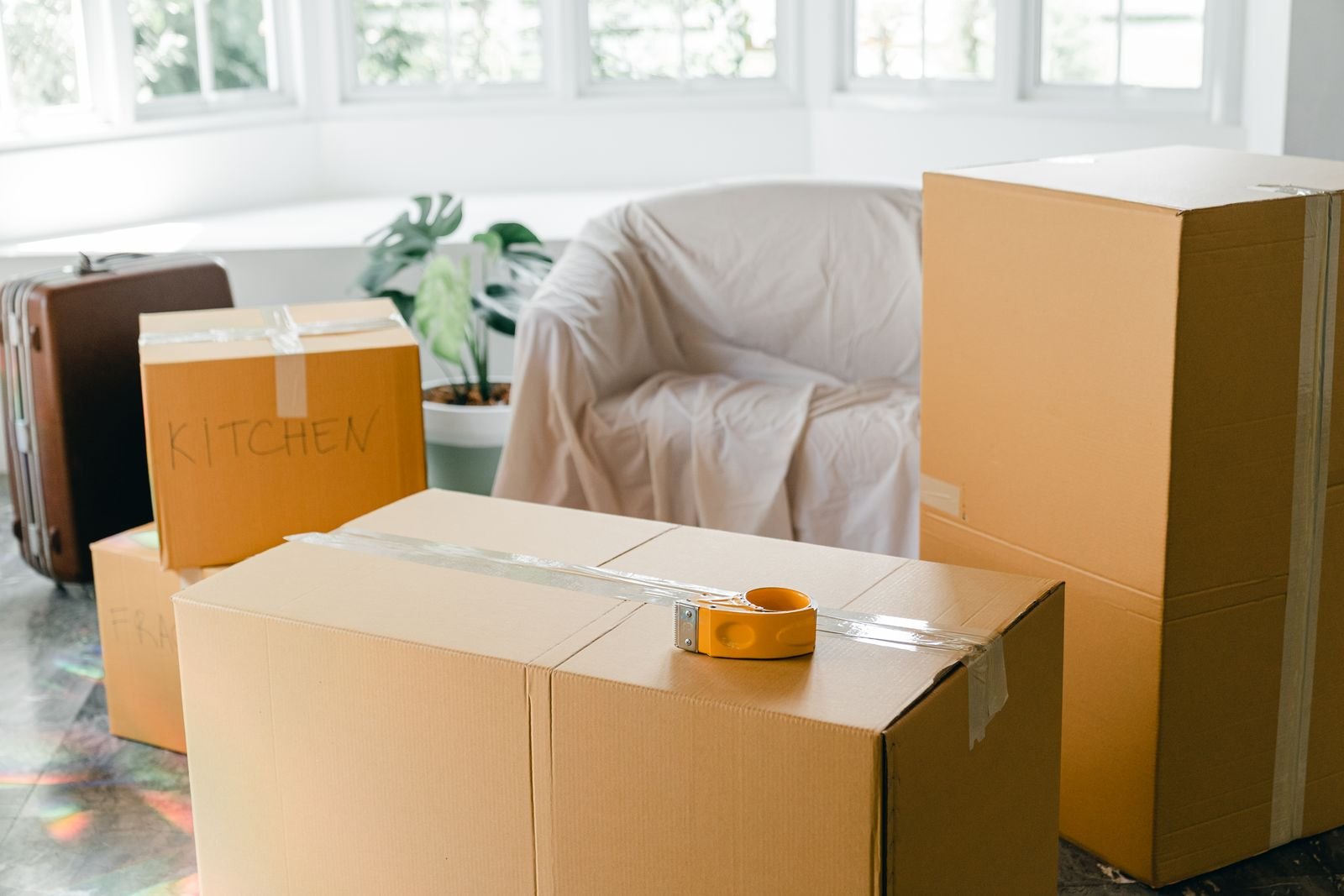 Packed moving boxes in an empty apartment
