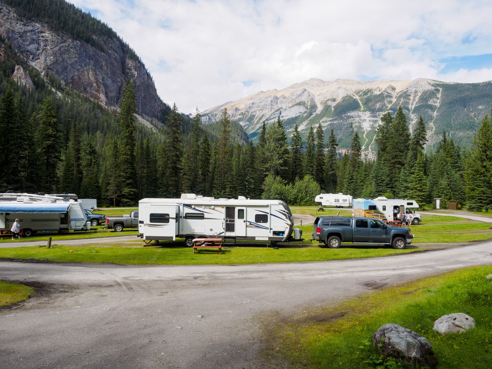 Travel trailers and trucks at a campground